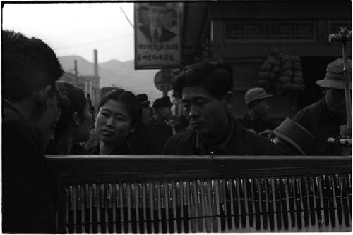 People talking on a crowded street