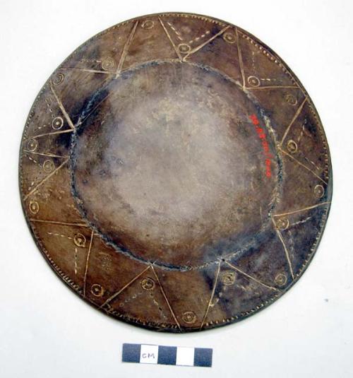 Shallow wooden dish with incised geometric design