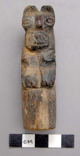 Small carved wooden figure - puma on a block