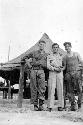 Men in front of tent