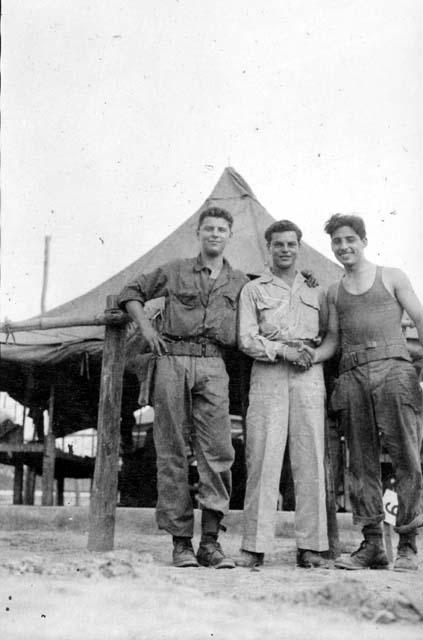 Men in front of tent