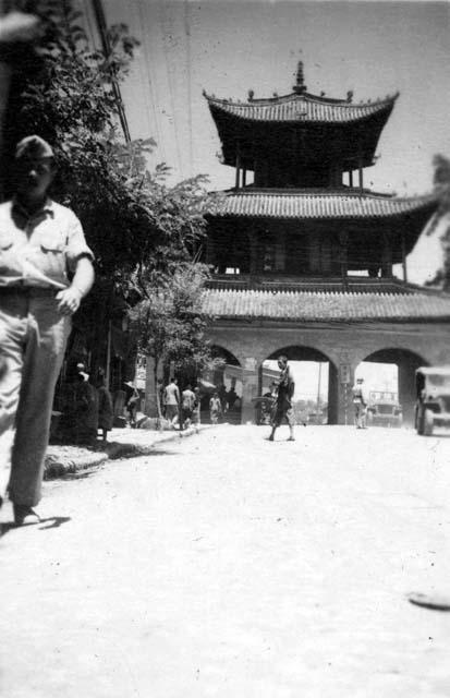 Soldier walking in front of gateway