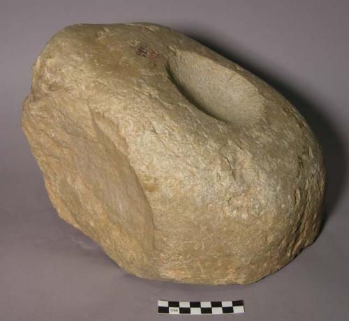 Mortar. irregular boulder; shallow circular depression (10.6 diam. 2.0 cm. deep)