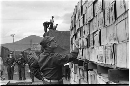 Man looking at boxes