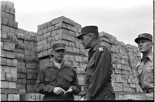 Two men in military uniform talking