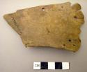 Skin fragment with holes - possibly leather sandal