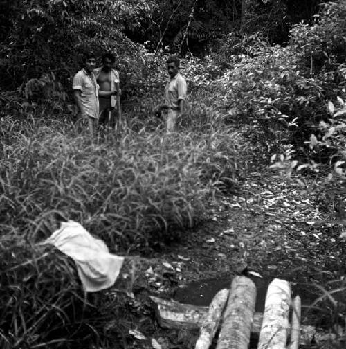 Digging for water by aguada at Naranjo