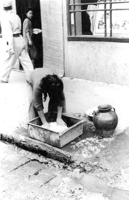 Woman washing dishes