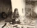 Hopi woman weaving plaques