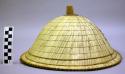 Woven hat with wood finial
