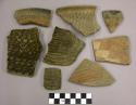 Ceramic sherds, corrugated body and rim, some from jar