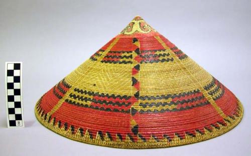 Woven hat with painted red and black bands