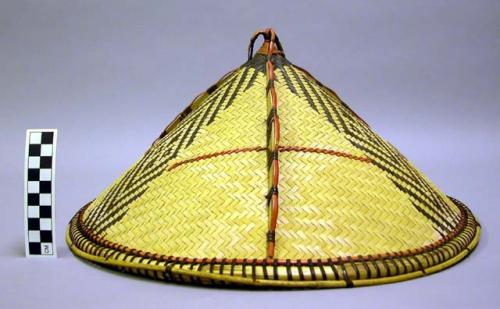 Woven hat with three strips of dark diamond and line pattern