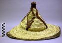 Straw hat with woven leather design and finial