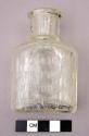 Clear glass tooth powder bottle, embossed