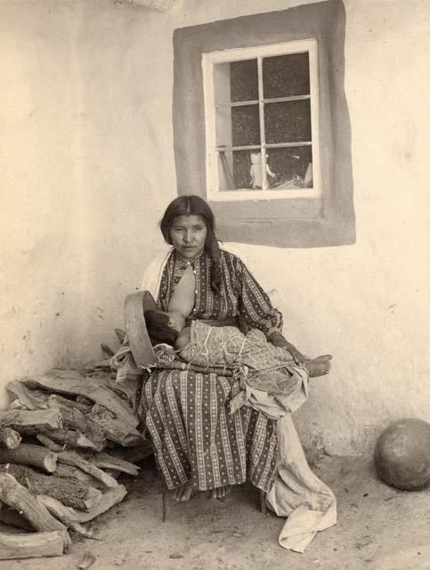 Hopi woman breastfeeding her baby