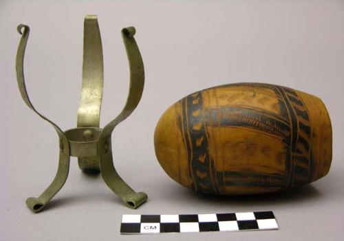 Incised and painted gourd vessel with metal stand