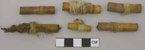 Wood, Cane cigarettes, wrapped in cotton fabric and knotted twine, some gathered