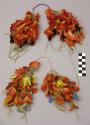 Men's feather and bead belt ornaments