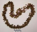 Seed necklace - brown seeds attached to fiber cord by strings of small beads