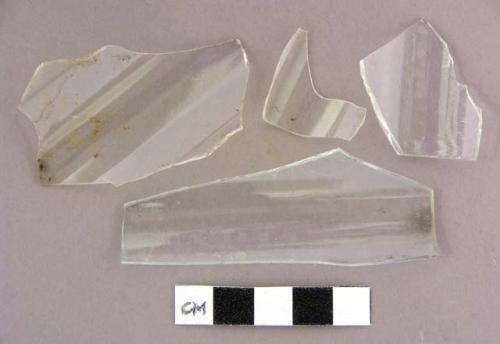 Glass, colorless bottle glass, fragments, curved