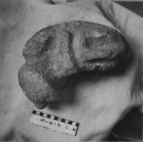 Animal effigy or death sculpture of fine purplish igneous stone