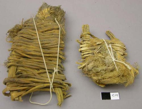 Fiber bundles, each plaited onto a frame; some secured after excavation with whi