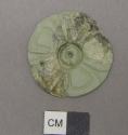 2 fragments of carved jade rosette