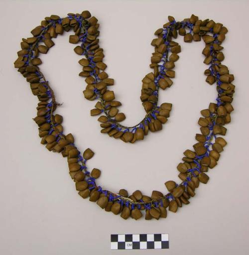 Seed necklace - brown seeds attached to fiber cord by strings of tiny beads