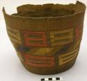 Basket--oblong design of orange, yellow and brown in false embroidery