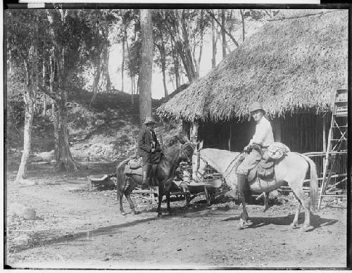 Gordon and Mozo on horses in western court