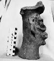 Annular base of incensario (?) Tlaloc face modelled. Smooth surface.