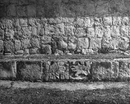 5C15. Reused sculptured stones on S side of dais. Point 8 on the sketch map.