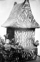 Pottery model of hut.