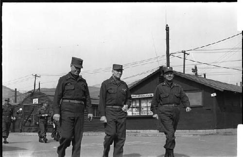 Three men in military clothing