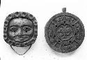Wooden Calendar and Disc With Carved Human Face