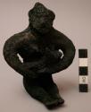 Figurine, ceramic, seated female, nursing child, heavily charred