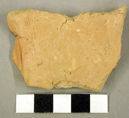 Ceramic body sherd, one side undecorated, one side textile impressed design