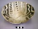 Pottery seed bowl - black on white, geometric design on inside