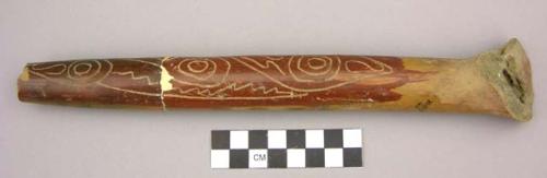 Red polished incised hollow tubular pottery handle