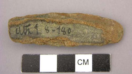 Ceramic fragment, tubular, roughly rectangular, terra cotta