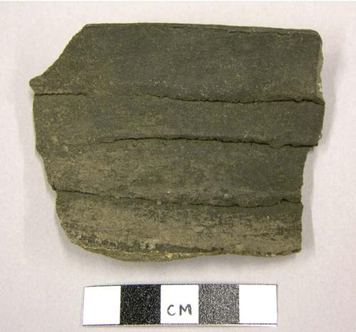 Ceramic sherd, jar?, rim sherd, clapboard-like texture, black