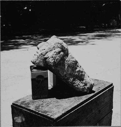 Sculptured stone head with long tenon