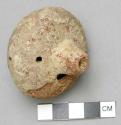Top effigy ocarina badly preserved, with rattle