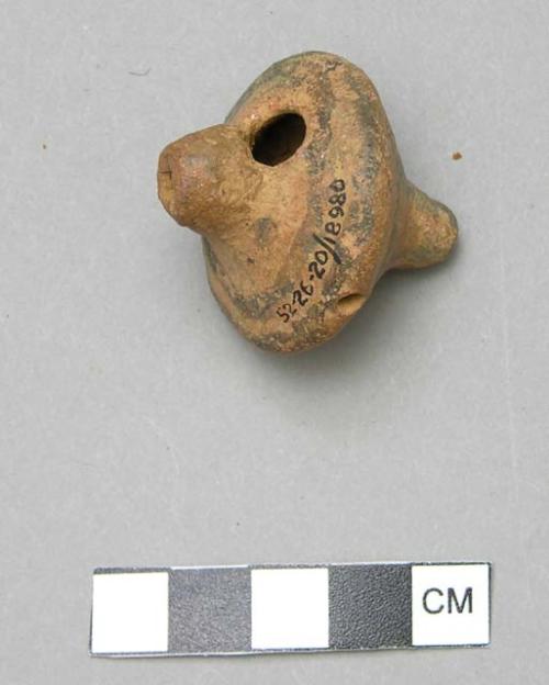 Ceramic whistle with traces of brown slip