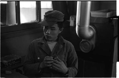 Man sitting down in some type of machine room