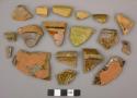 Dark brown and greenish brown slip glazed redware vessel body, base, and rim fragments, 2 fragments burned