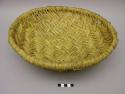 Shallow wicker work basket of soap root