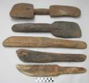 4 knife-like wooden batten-shaped objects