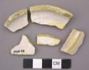 Ceramic sherds, base and body fragments, white glaze on buff